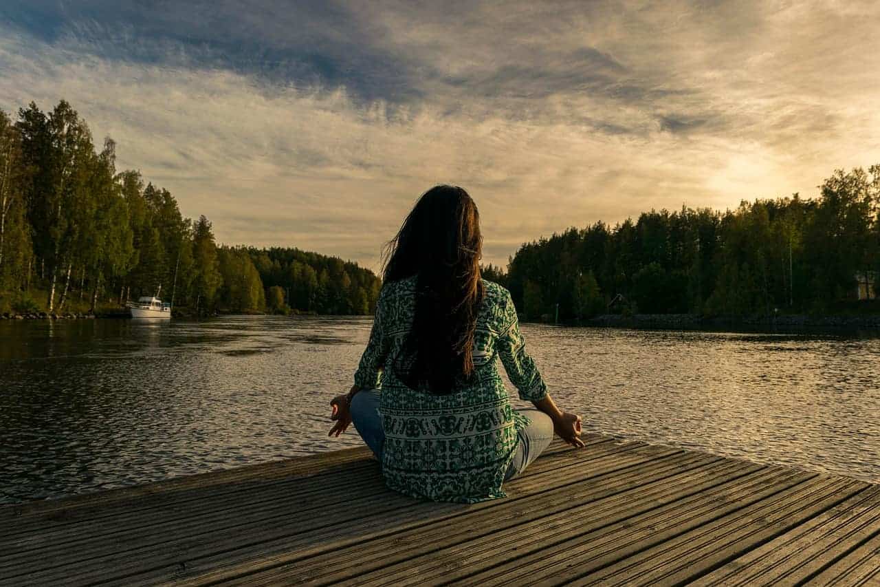 meditating woman trees