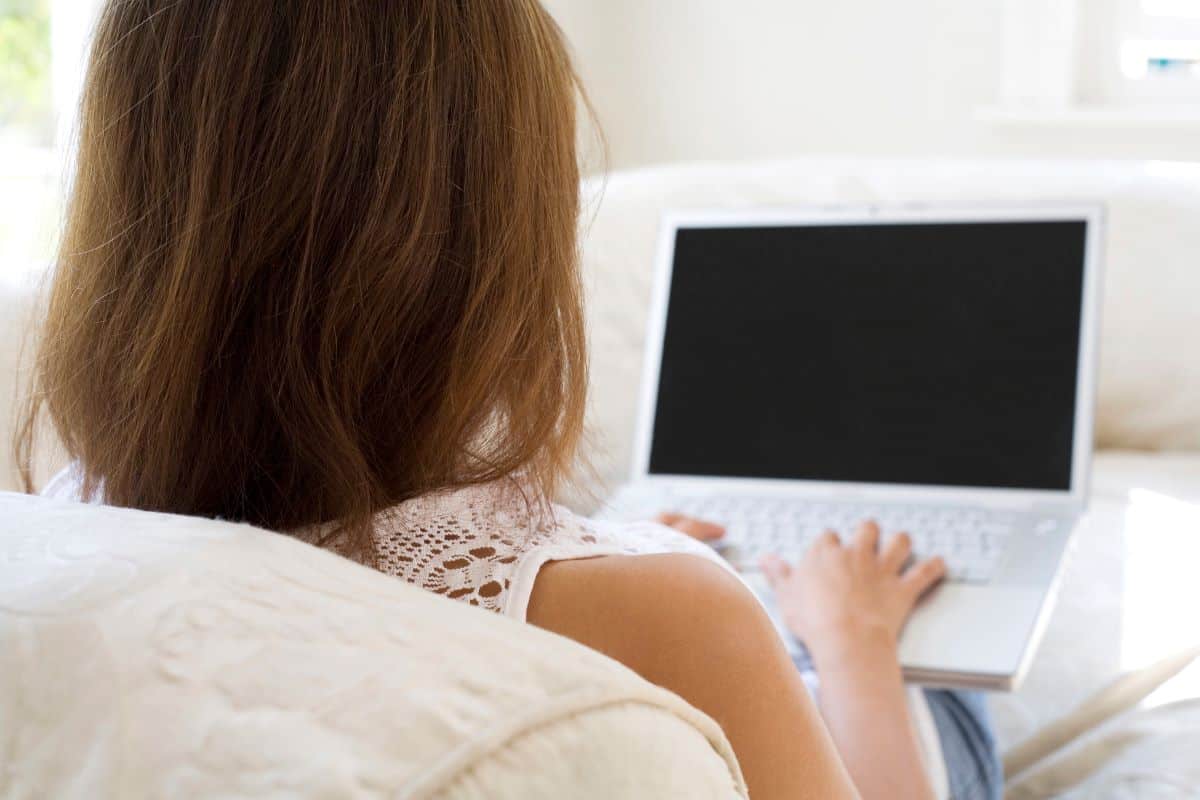 woman opening laptop