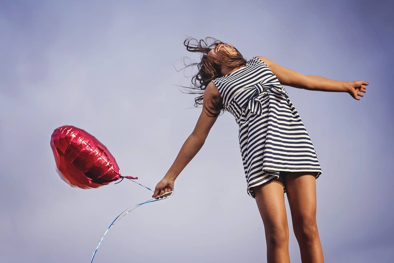 holding balloon letting go