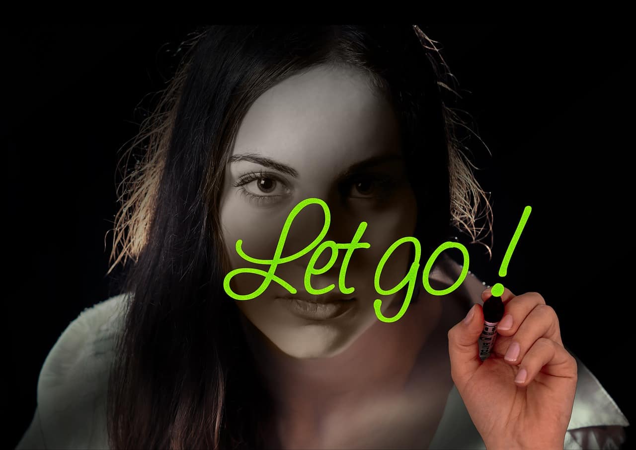 woman writing let go