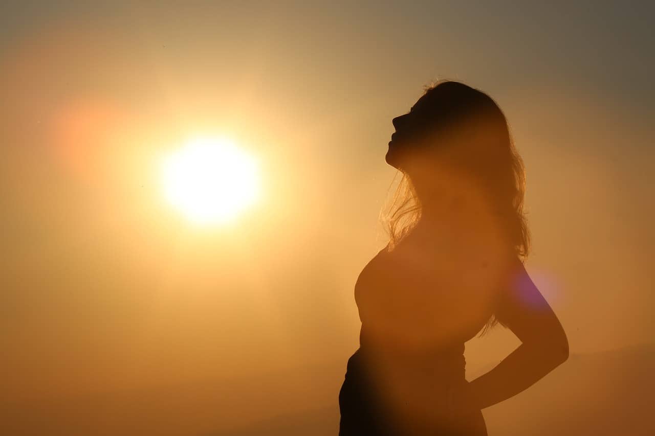  woman contemplating sunrise