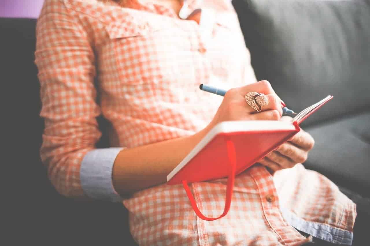 woman writing journal