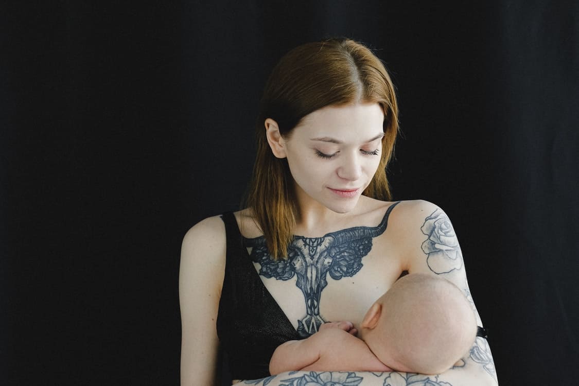 woman breastfeeding baby