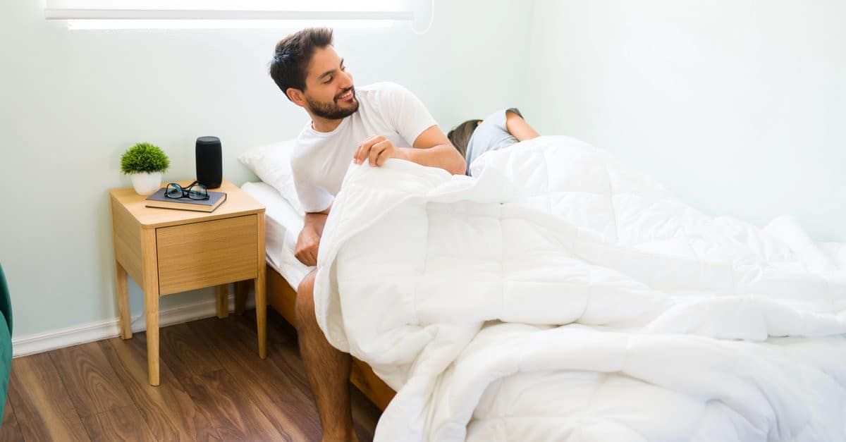 man leaving bed