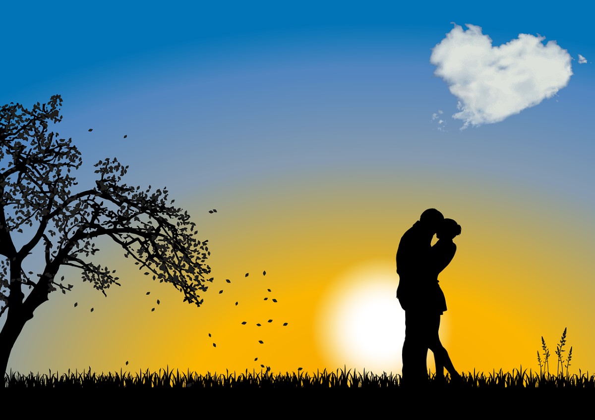 silhouette of a couple kissing