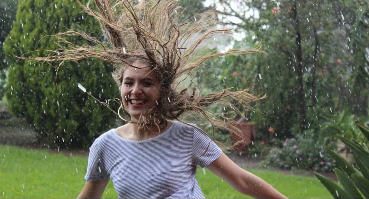 woman having fun in the rain