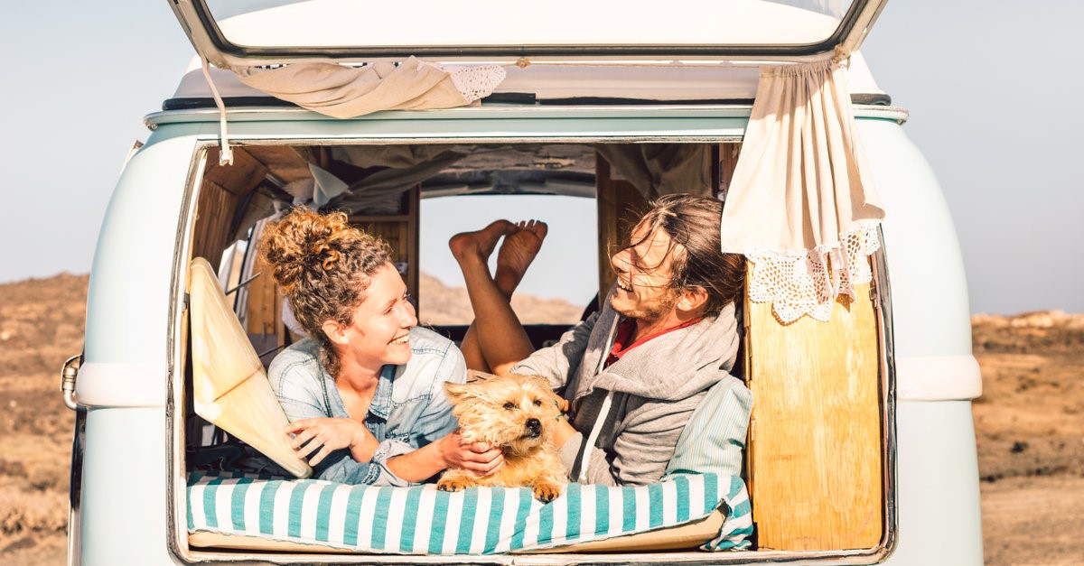couple travelling together with their dog