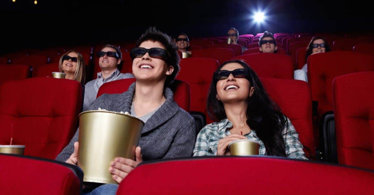 couples wearing 3d glasses in a cinema