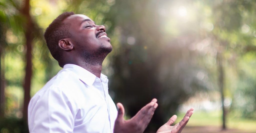 man praying to god