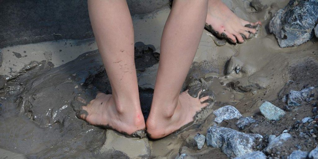 barefoot on mud