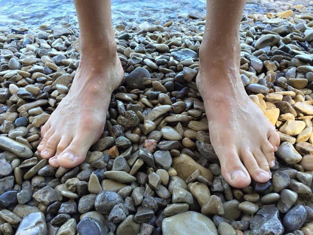 barefoot on stones