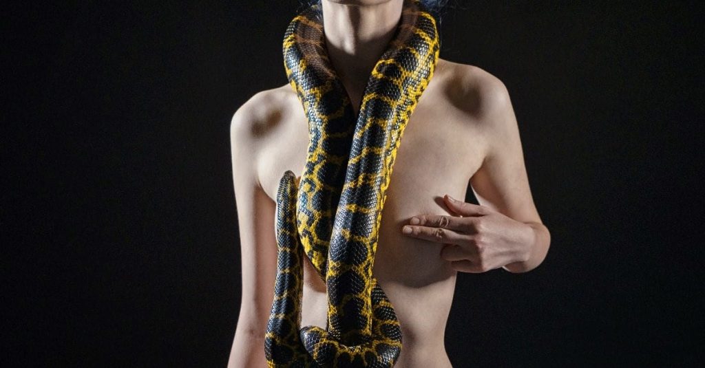 black snake on woman's body