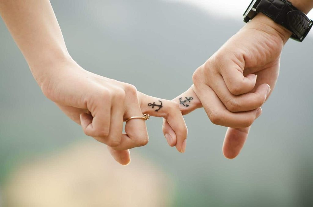 couple holding their index finger together