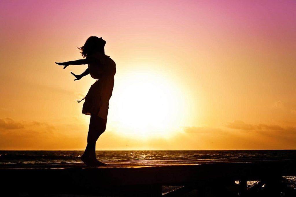 woman basking on the ocean breeze