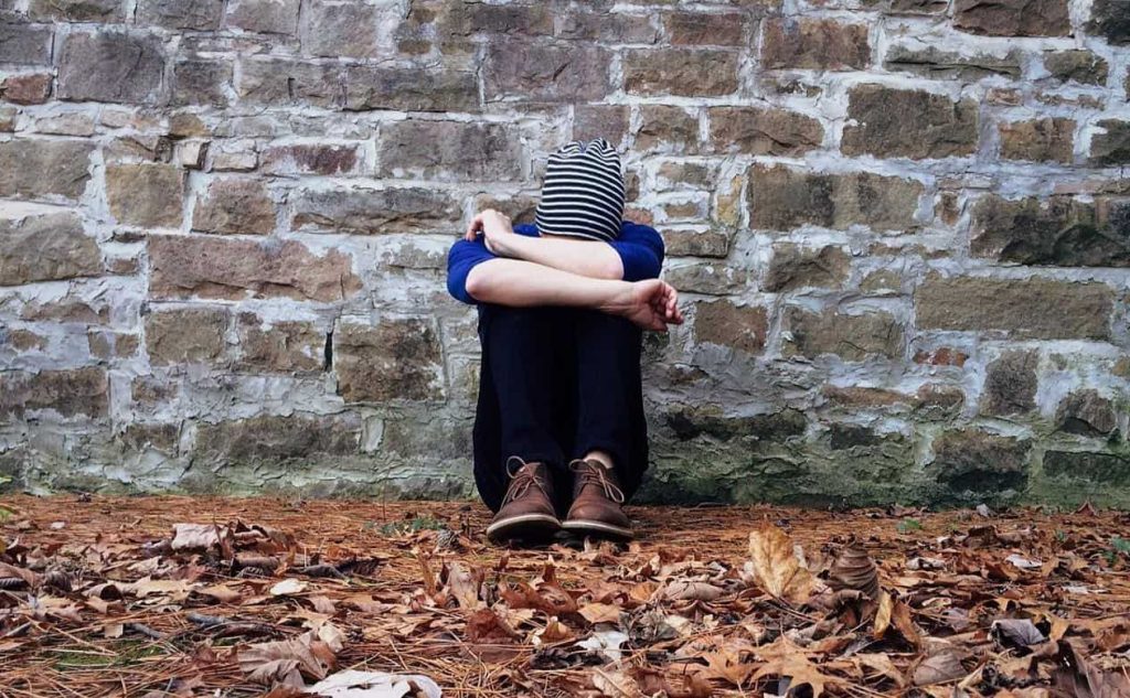 woman crying on the wall