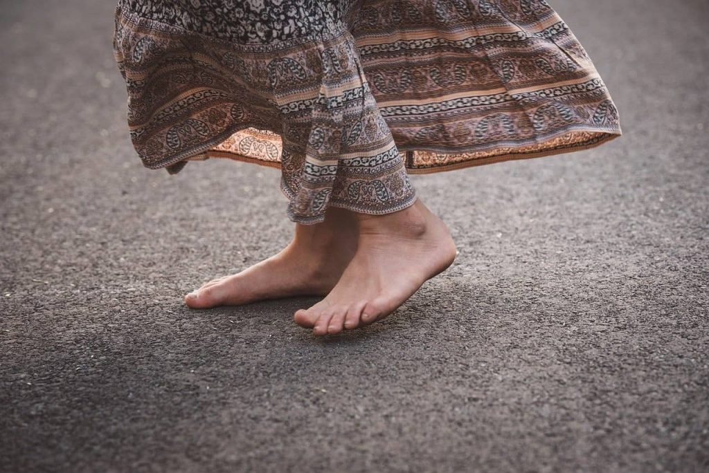 woman's feet on a concrete