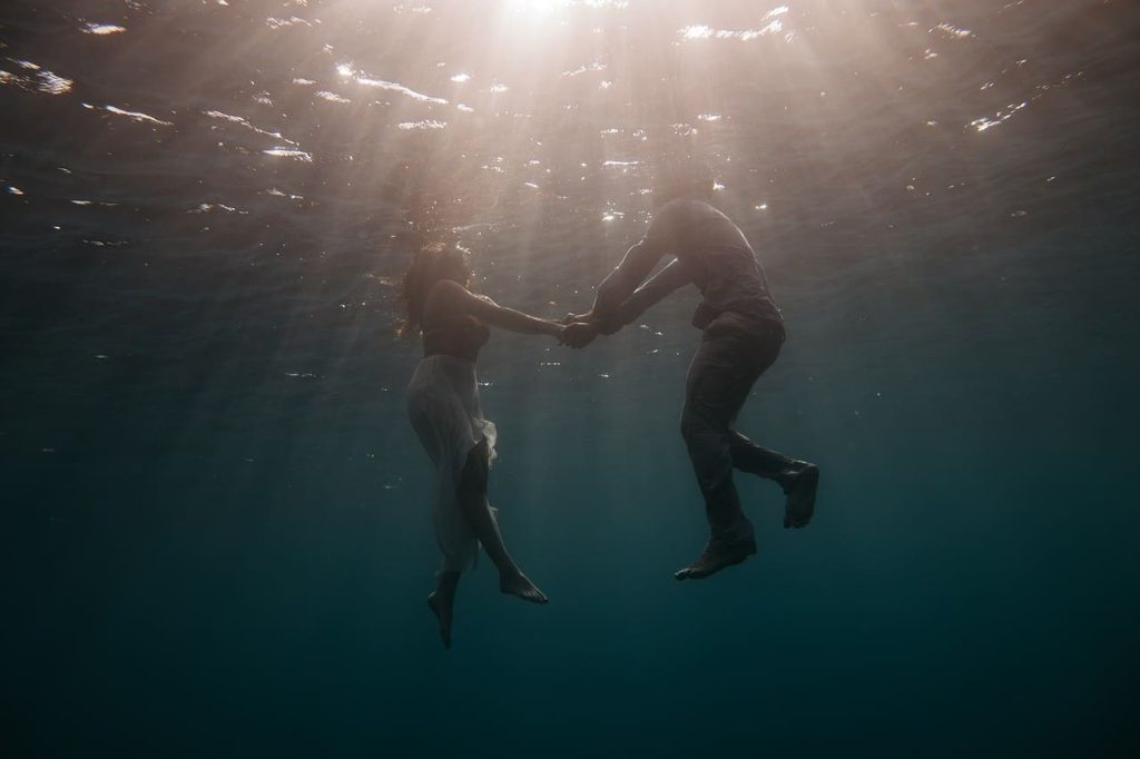 couple underneath the ocean