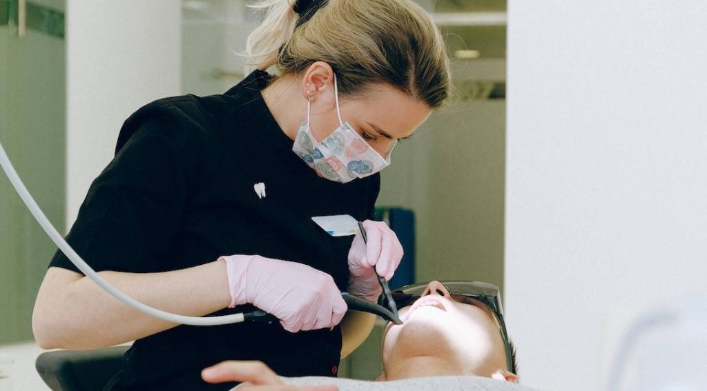 dentist working on a man's teeth