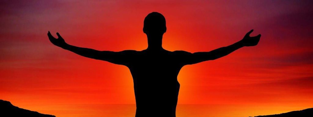 silhoutte of a man with open arms