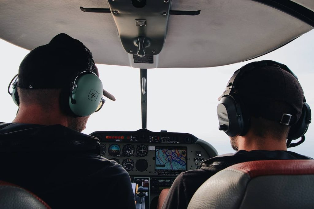 two men flying a plane