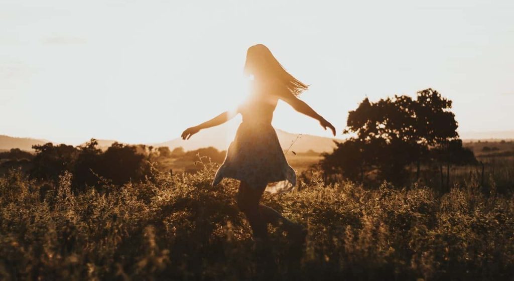 woman dancing in the meadow