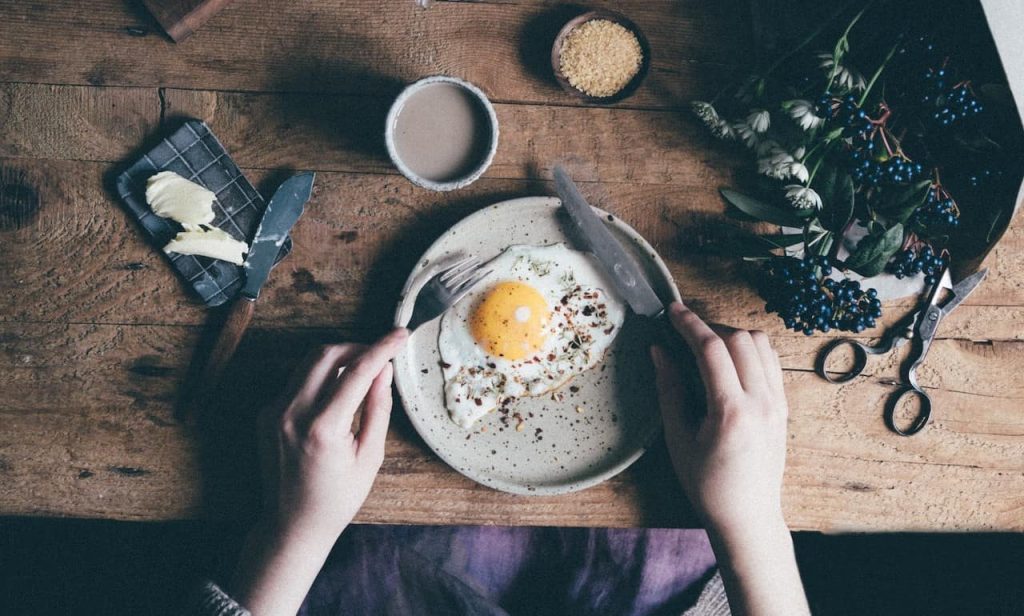 woman eating an egg