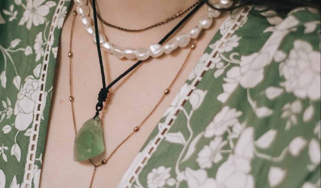 woman with green crystal necklace