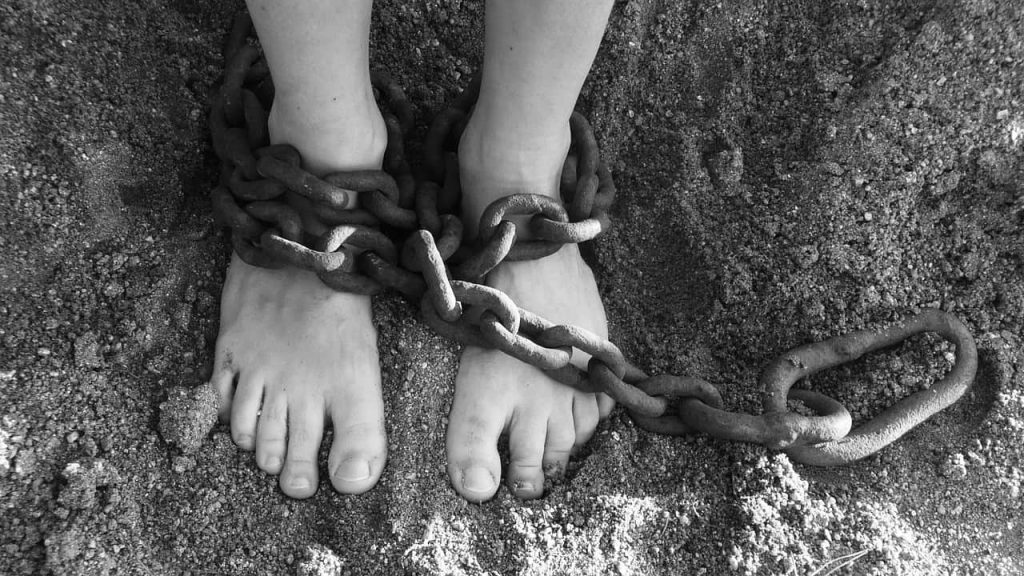 woman's feet in chains