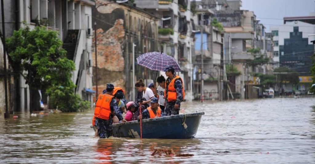 group of people on a boat evacuating during a flood