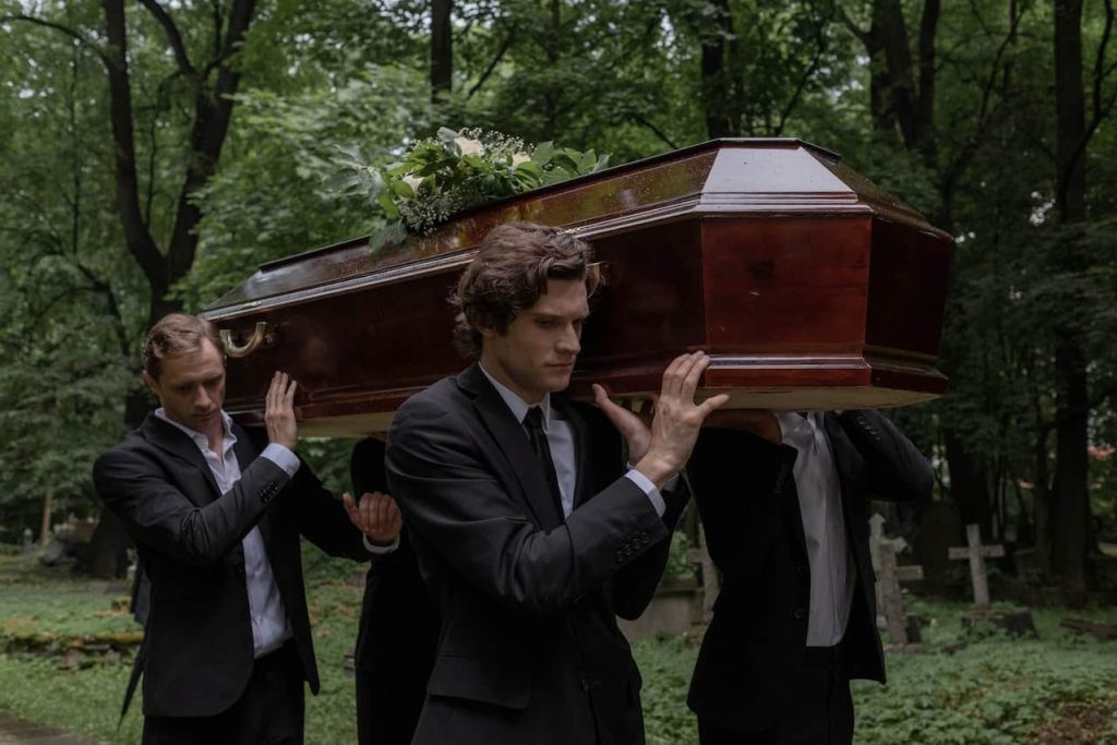 men carrying coffin