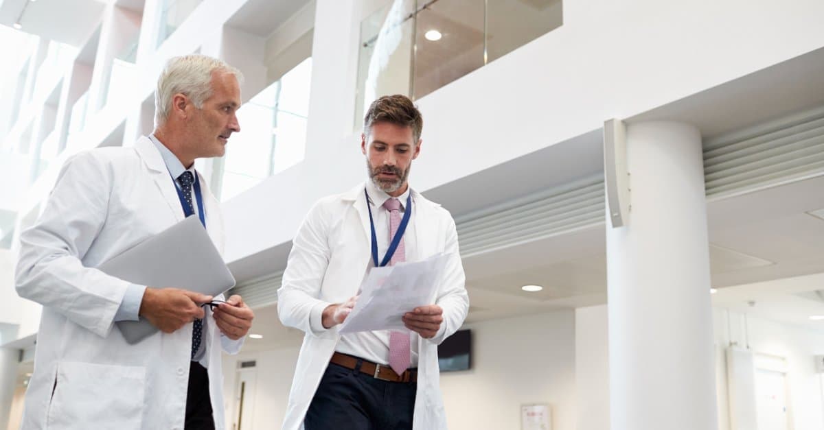 two doctors walking on a hospital