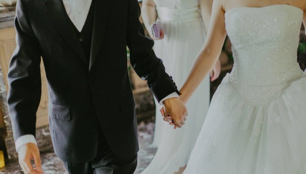newlyweds holding hands
