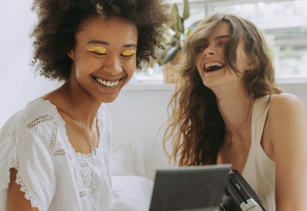 two woman laughing