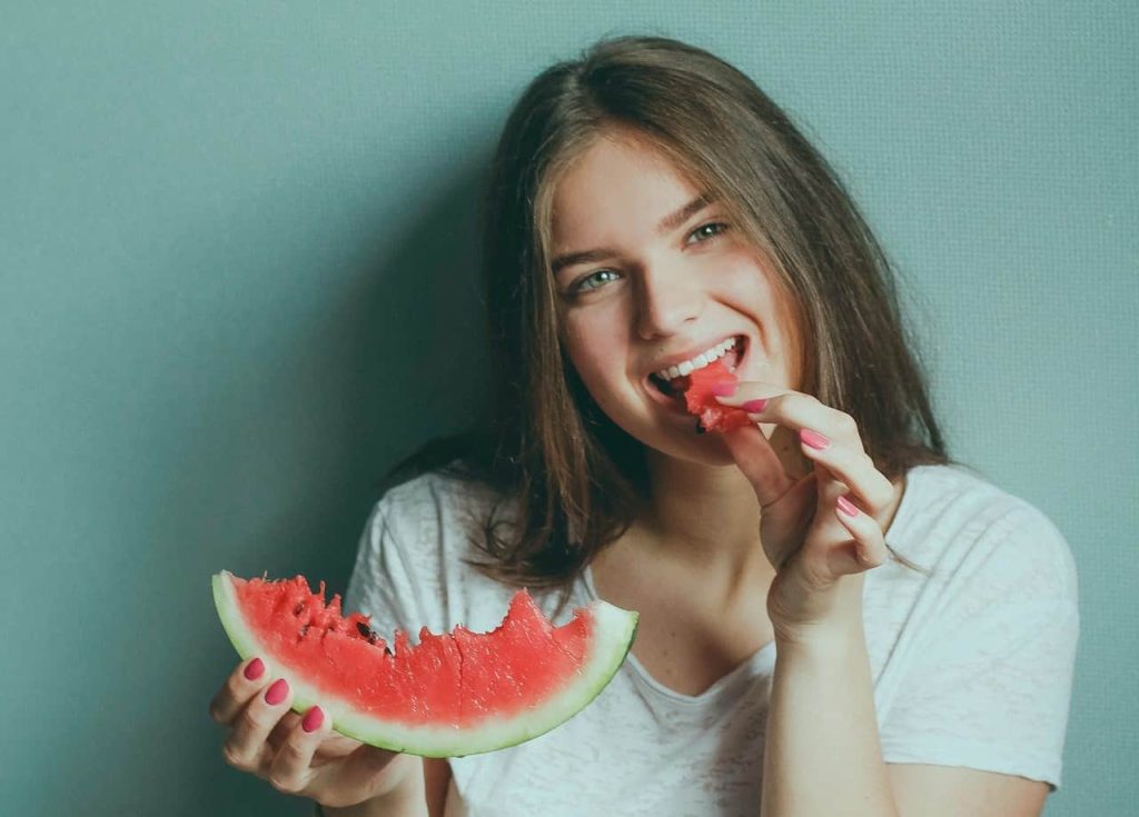 woman eating watermelon