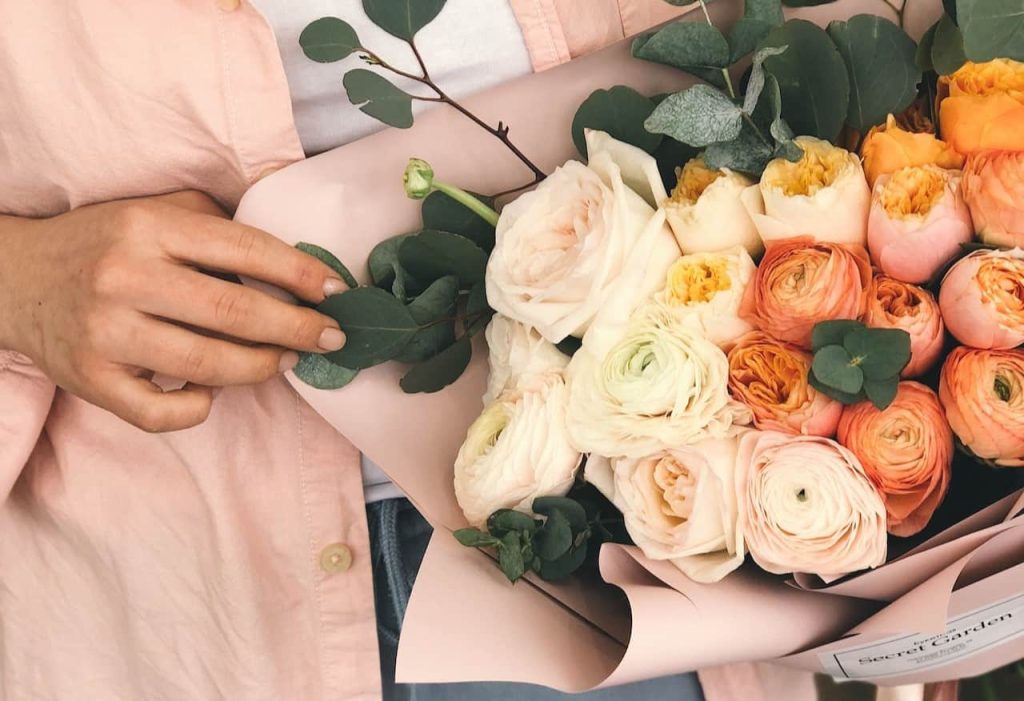 woman holding a bouquet of flowers