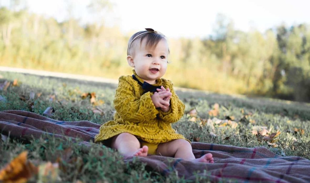 baby girl wearing yellow dress
