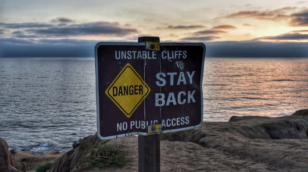 danger sign on a cliff