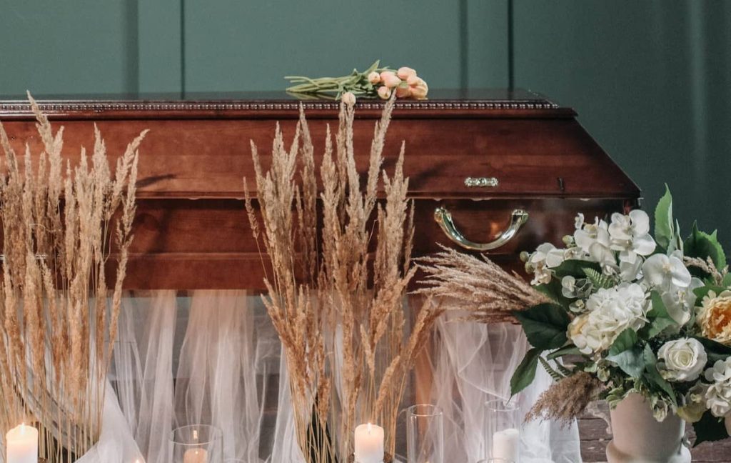 flowers surrounding a casket