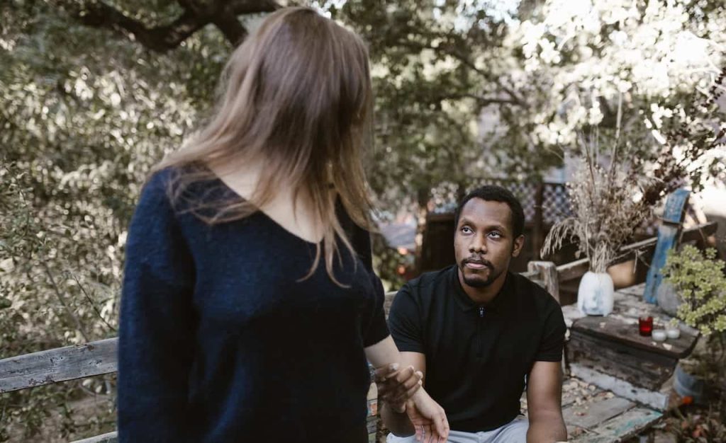 man holding a woman's hands