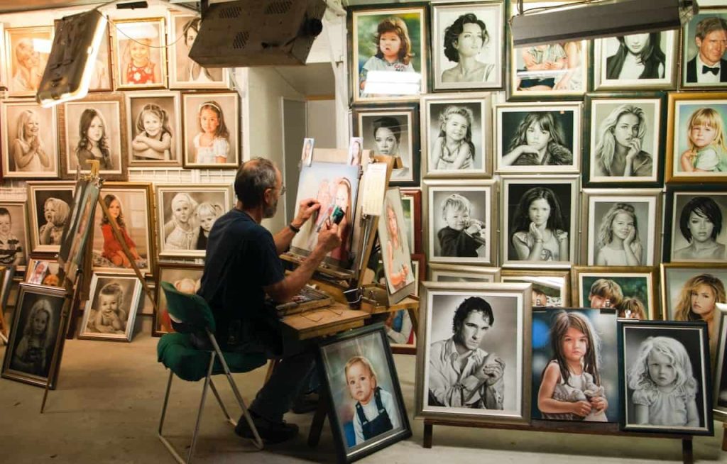 man painting inside a room