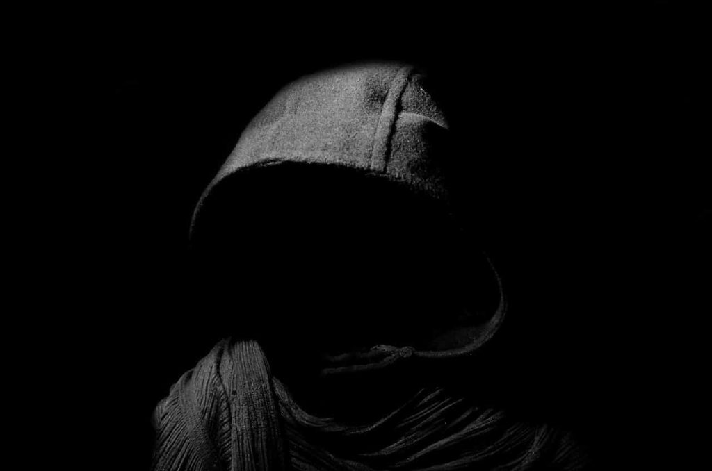 shadow of a man wearing a hoodie