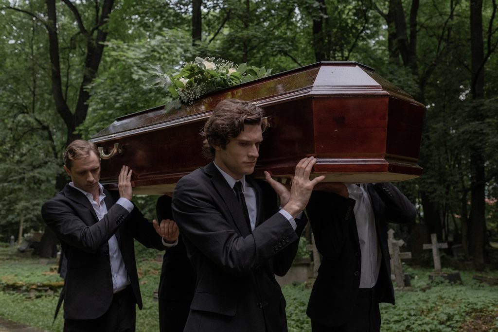 people carrying coffin