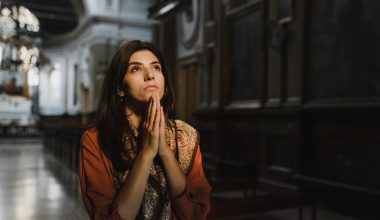 woman praying inside church