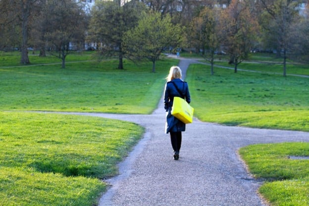 woman walking at crossroads