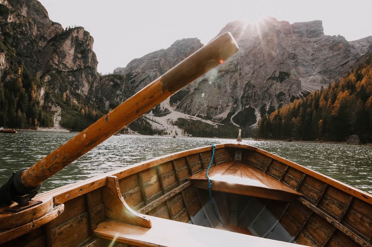 wooden canoe near a mountain