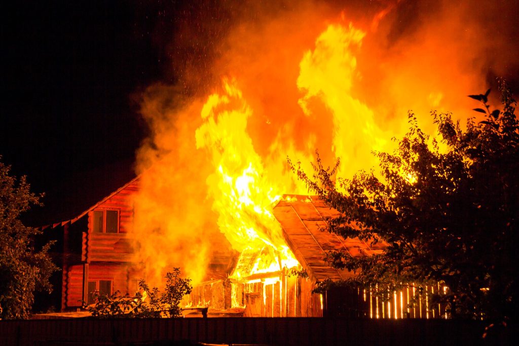 wooden house on fire